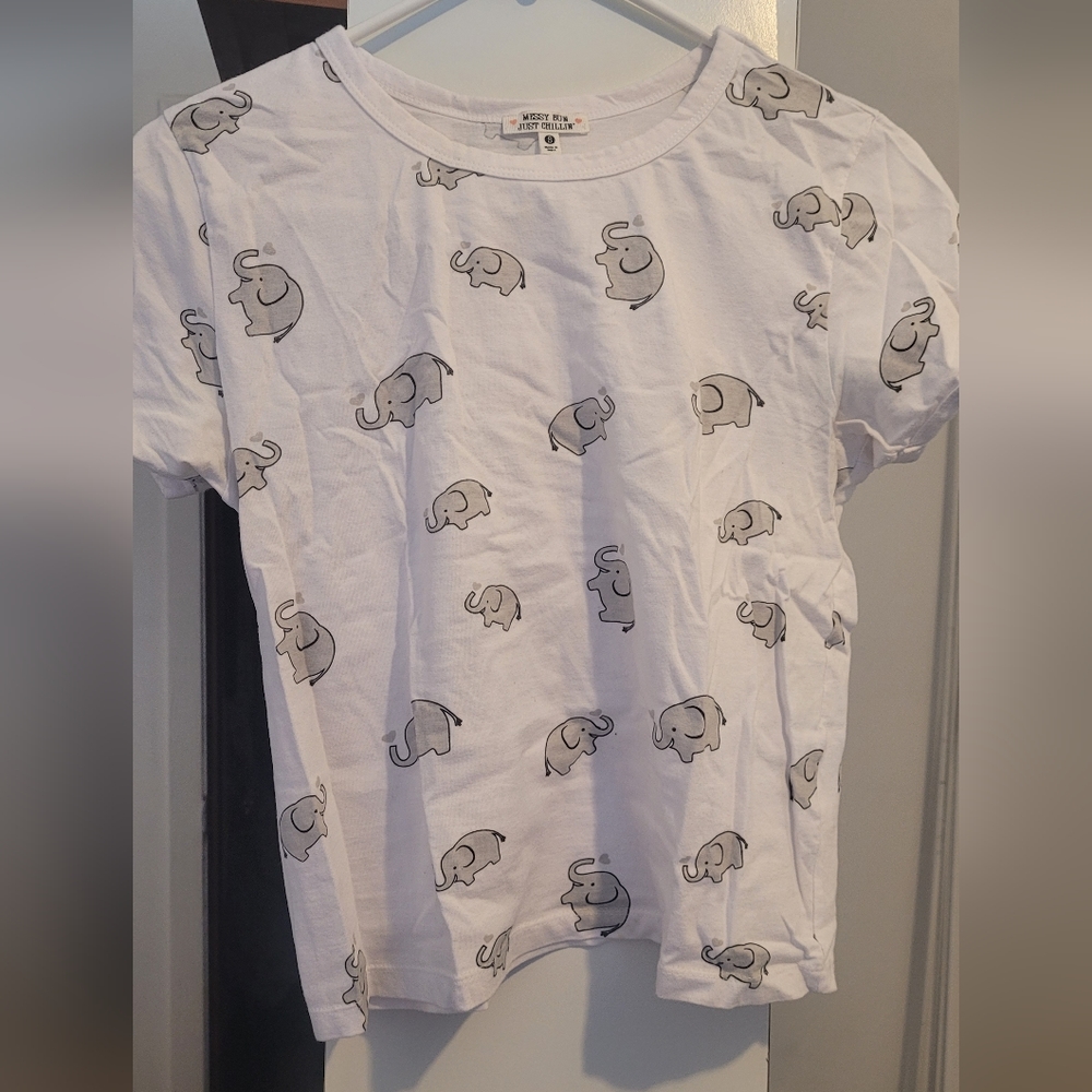 white top with elephant print